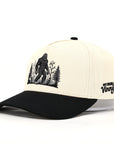 Beige and black cap with a Sasquatch graphic on a white background