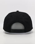 Black cap on a light gray background