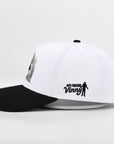 White and black cap with 'Our Friend Vinny' text and logo on a white background