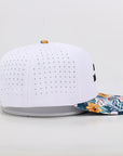 White baseball cap with floral brim on a light gray background