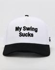 White cap with black text 'My Swing Sucks' on a light gray background