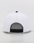 White cap with black interior on a light gray background