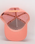 Pink baseball cap with perforated design