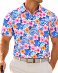 Man wearing the Birdies in Bloom tropical floral golf polo