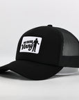Black trucker cap with a white logo on a light gray background