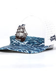 Cap with ship design on water pattern and visible brand logo