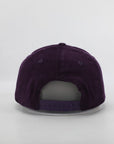 Purple baseball cap on a light gray background