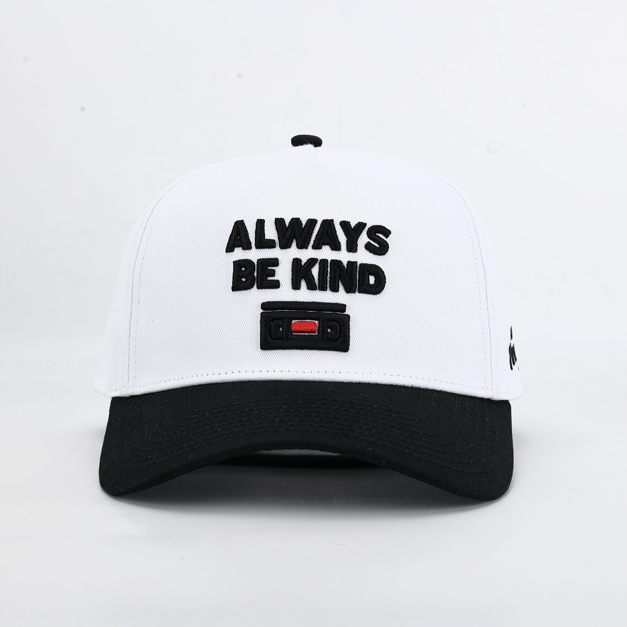White cap with black text 'Always Be Kind' 