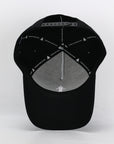 black cotton golf cap underneath 