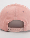 Pink corduroy cap on a light gray background