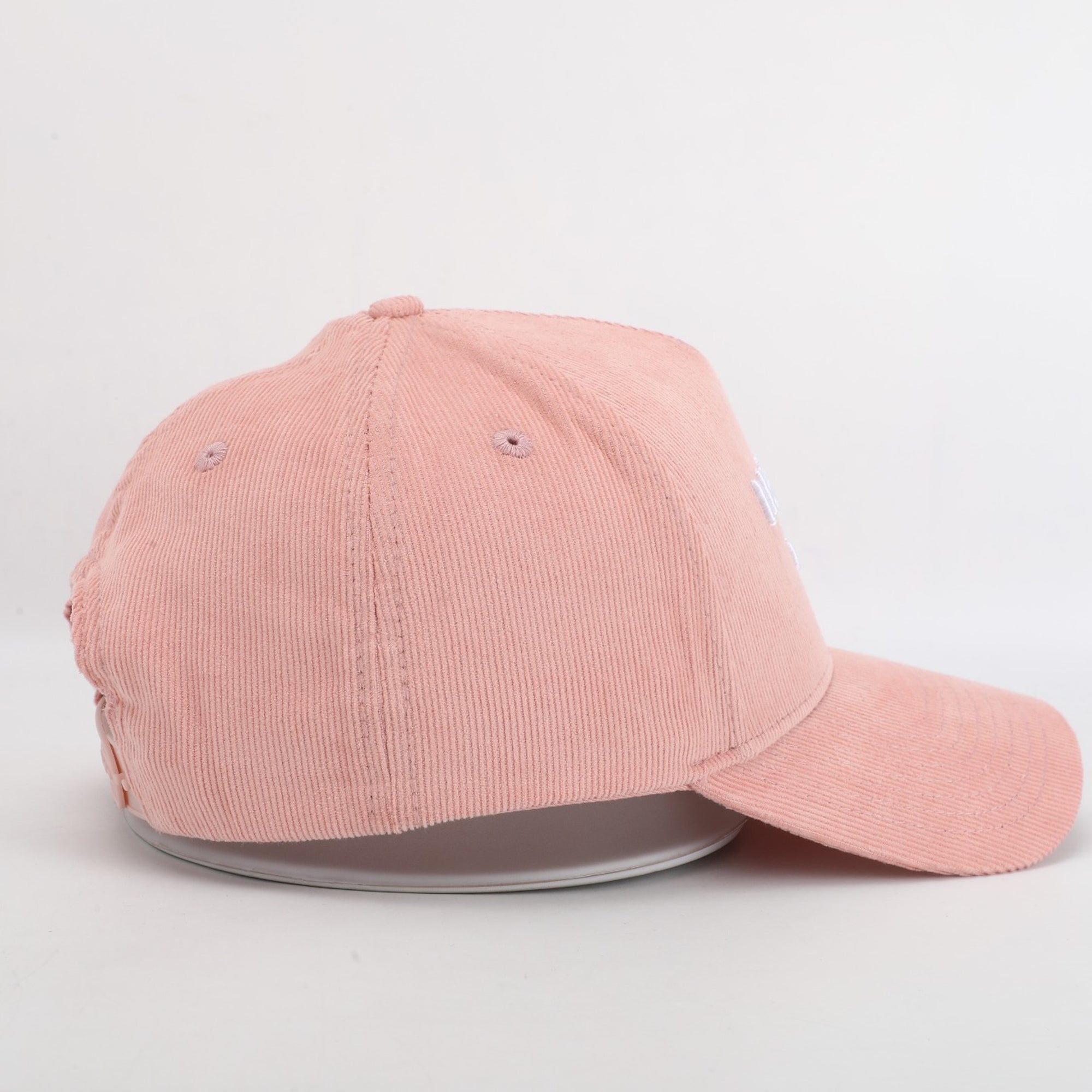 Pink cap on a light gray background