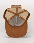 Brown cap with beige interior on a white background