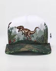 Cap with dinosaur design on a white background