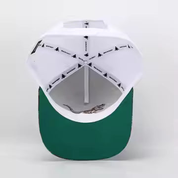 green brim underneath white hat 