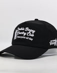 Black cap with white text and branding on a light gray background