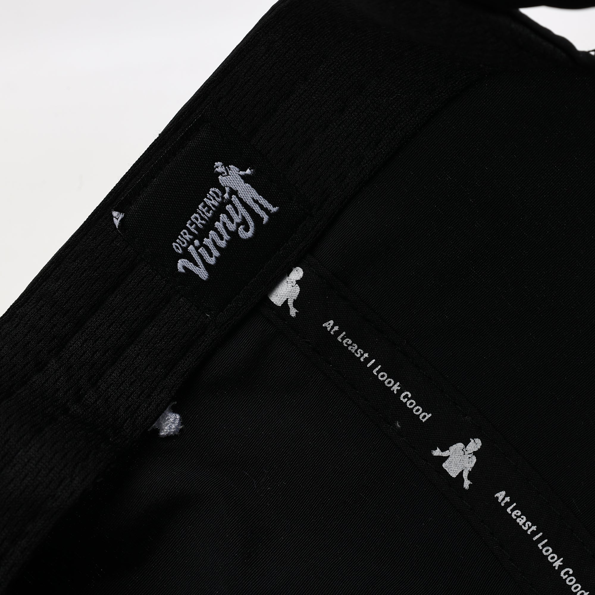 Black jacket with white text and graphics on a white background