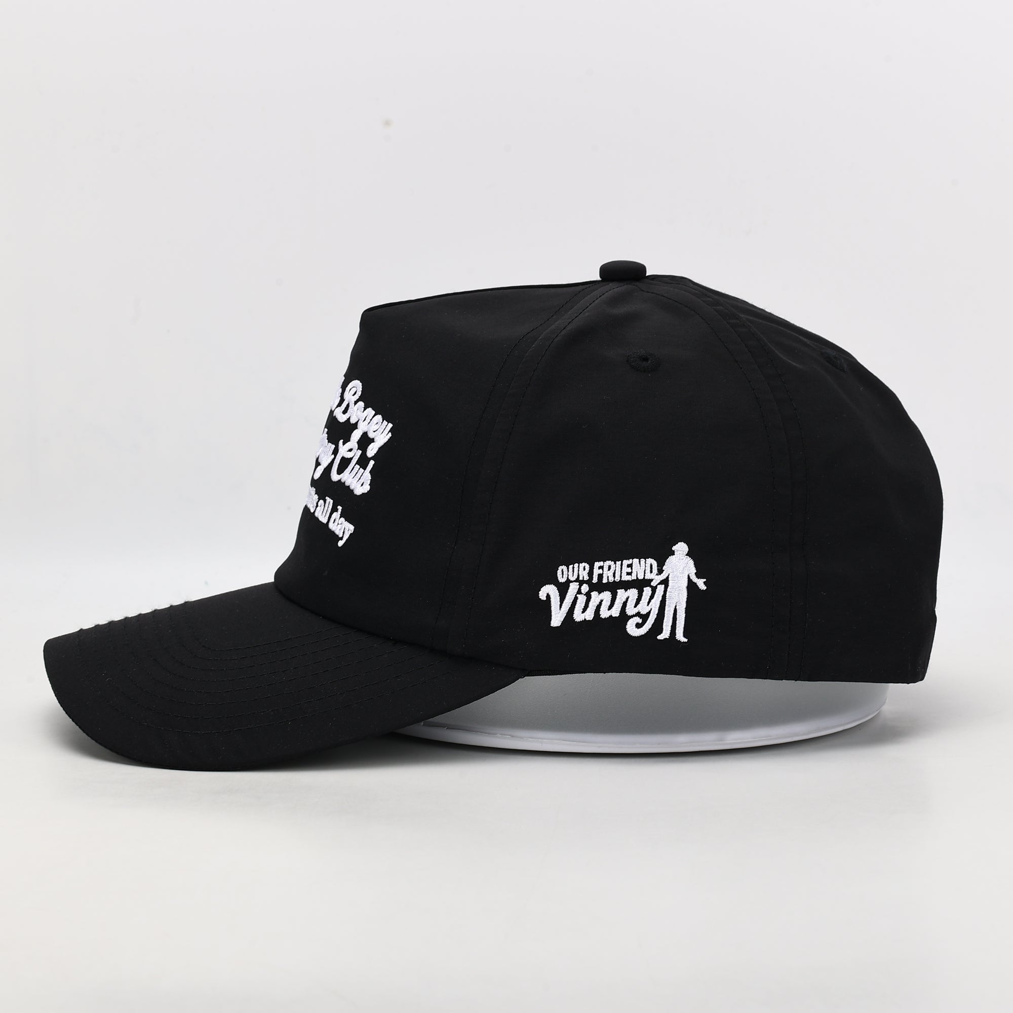 Black cap with white text and logo on a white background