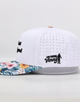 White cap with floral brim and black text on a light gray background