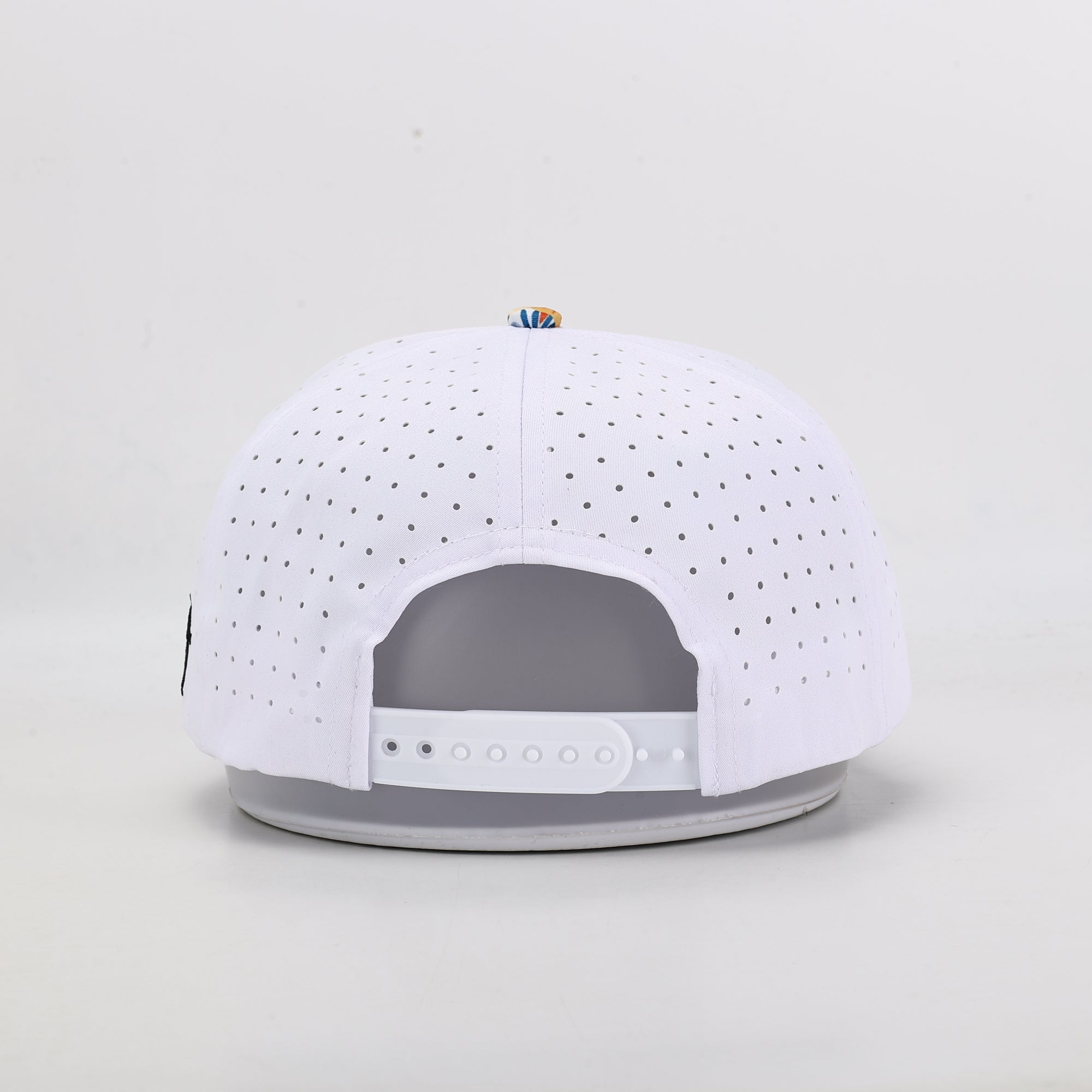 White baseball cap with gray interior on a light gray background