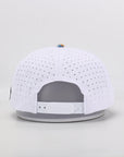 White baseball cap with gray interior on a light gray background