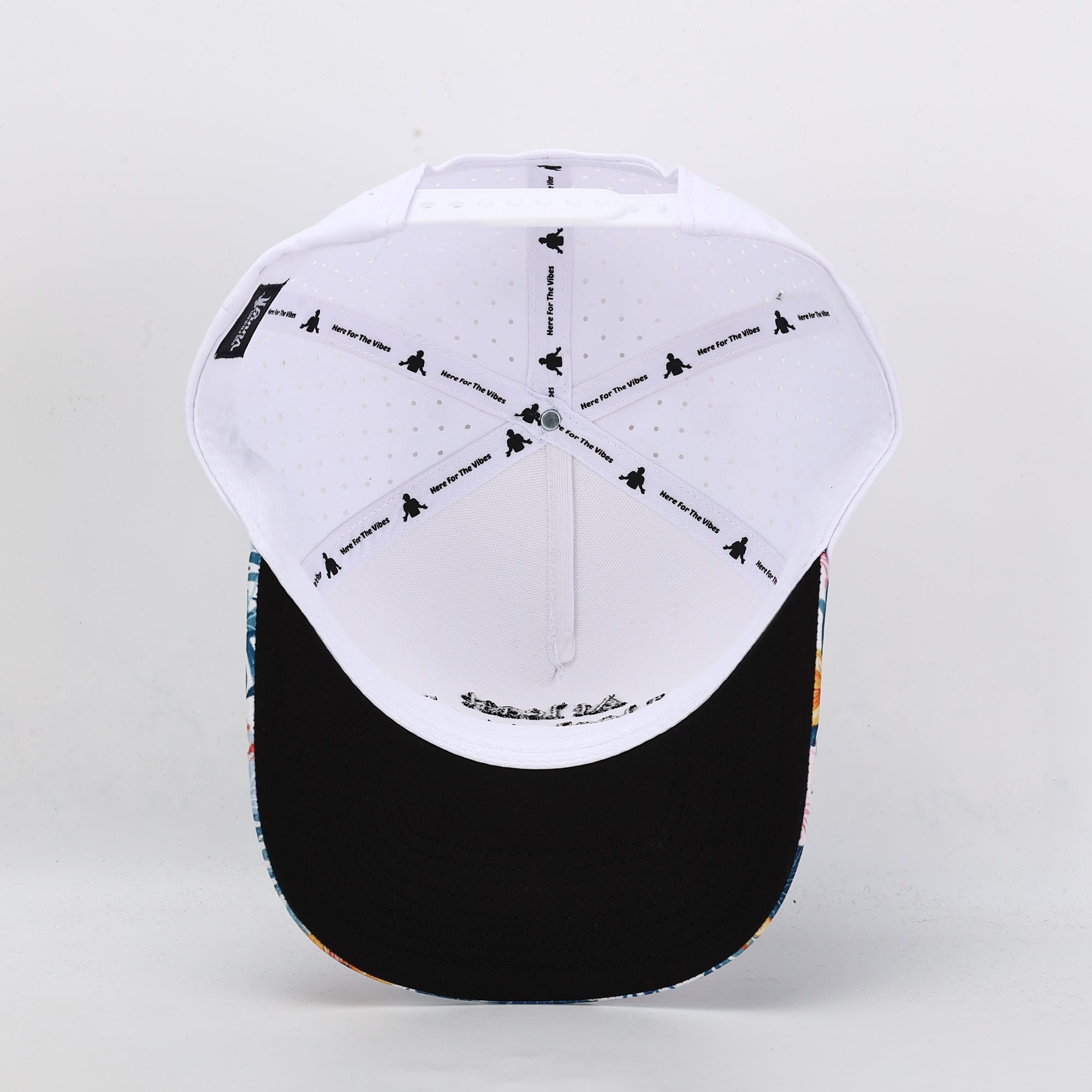 Baseball cap with white top and black brim on a light gray background