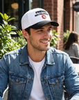 White cap with black brim 