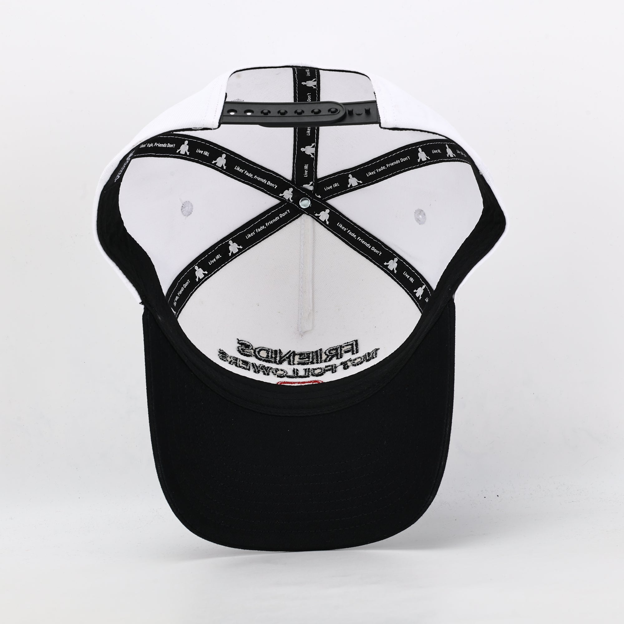white hat with black brim 