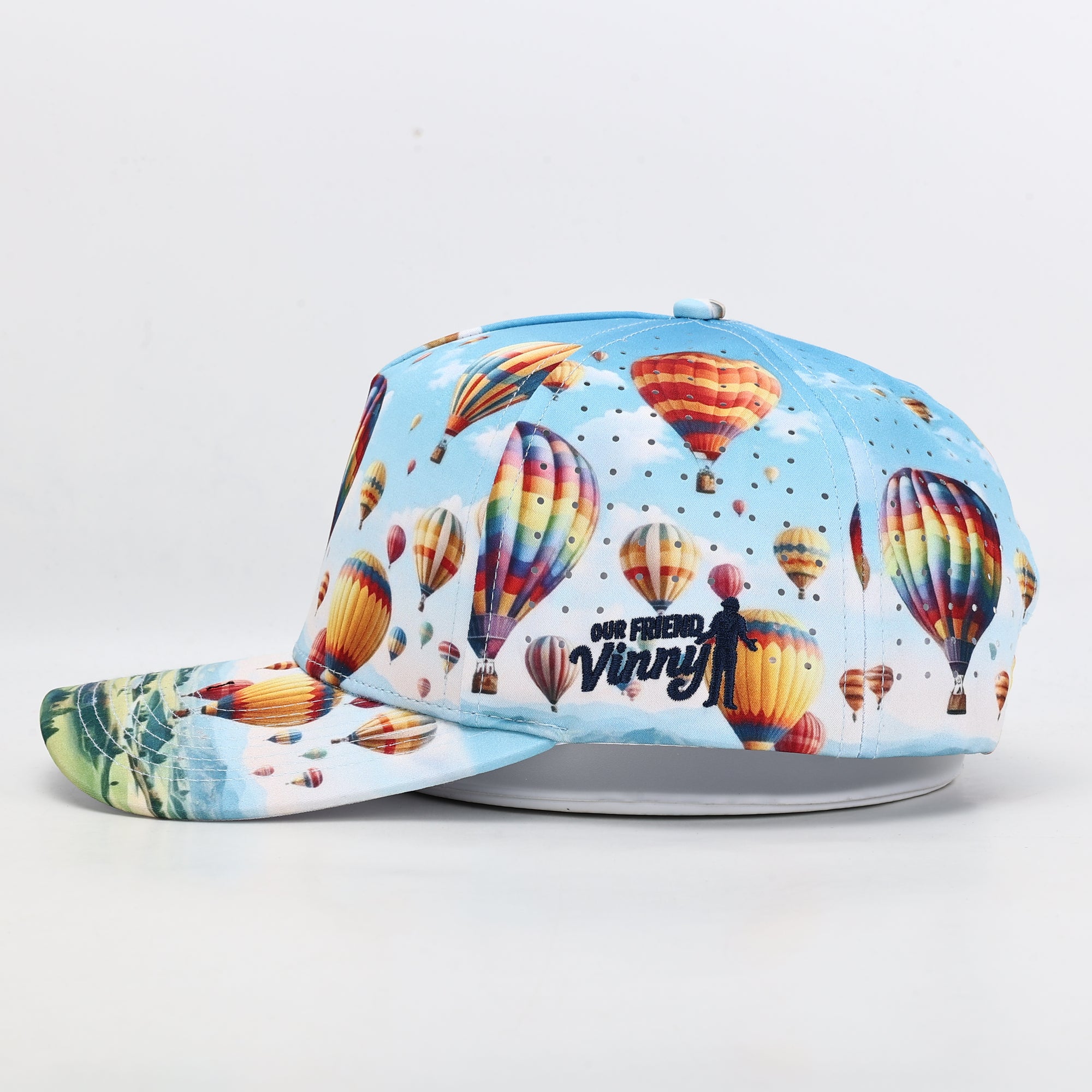 Colorful cap with hot air balloon design on a light gray background