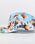 Colorful cap with hot air balloon design on a light gray background