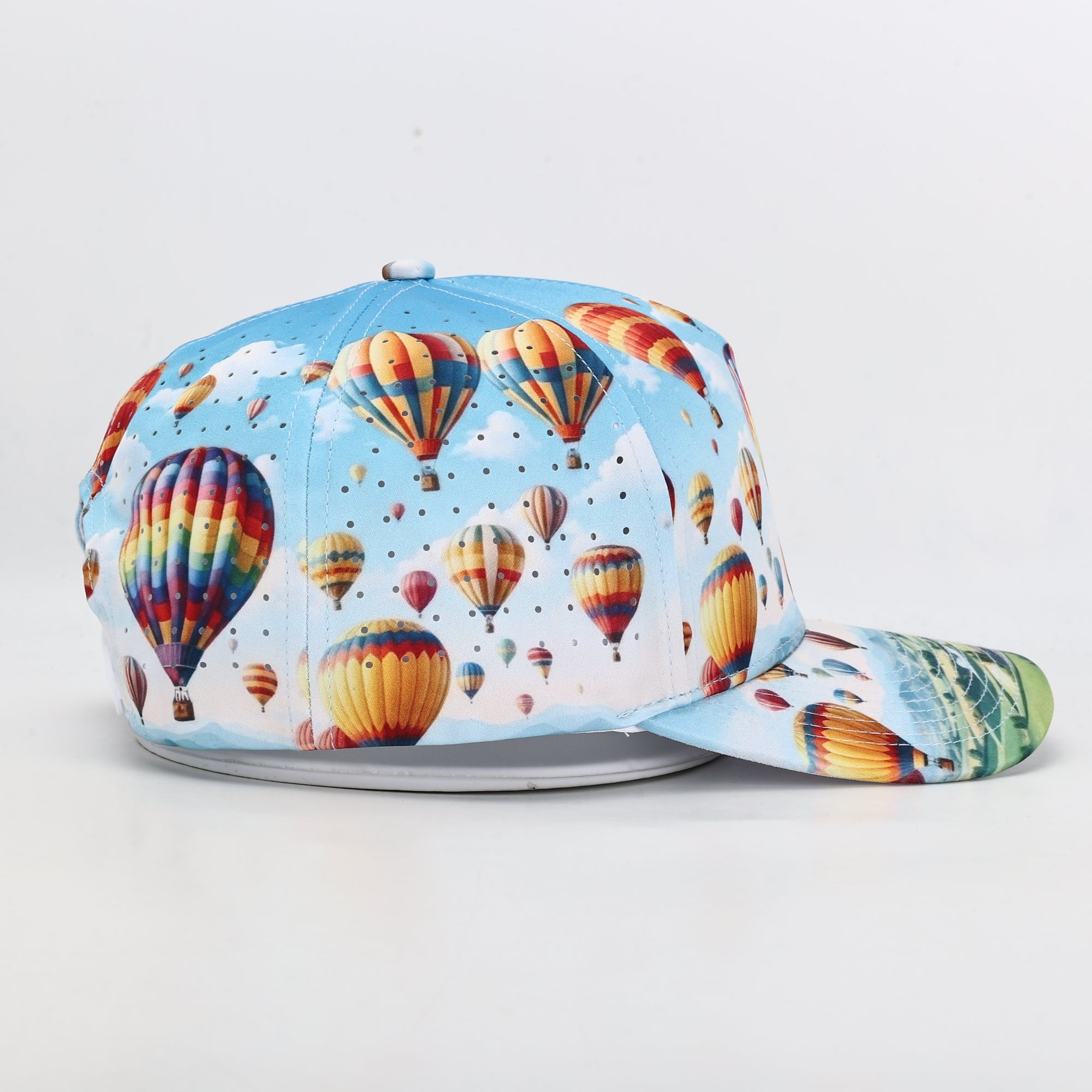 Colorful cap with hot air balloon design on a light gray background