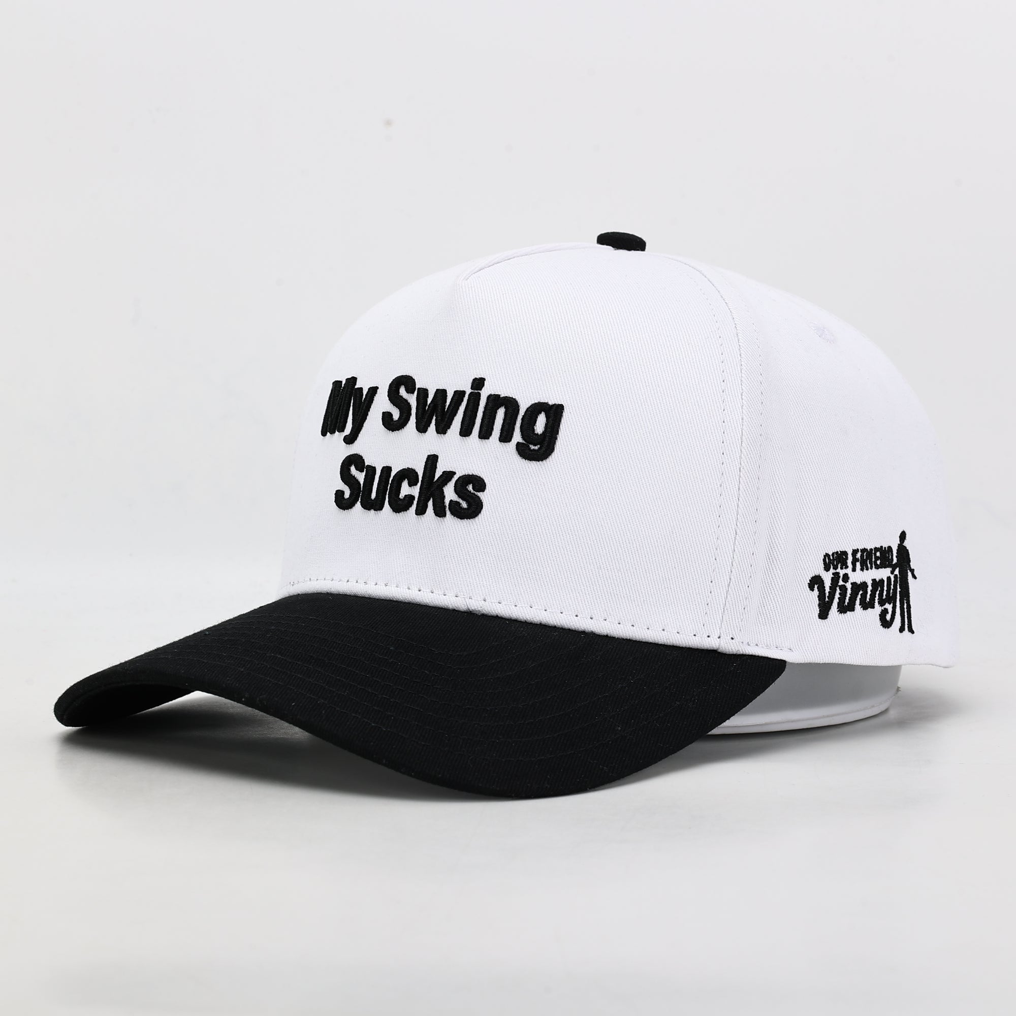 White cap with black text and logo on a light gray background - black brim 