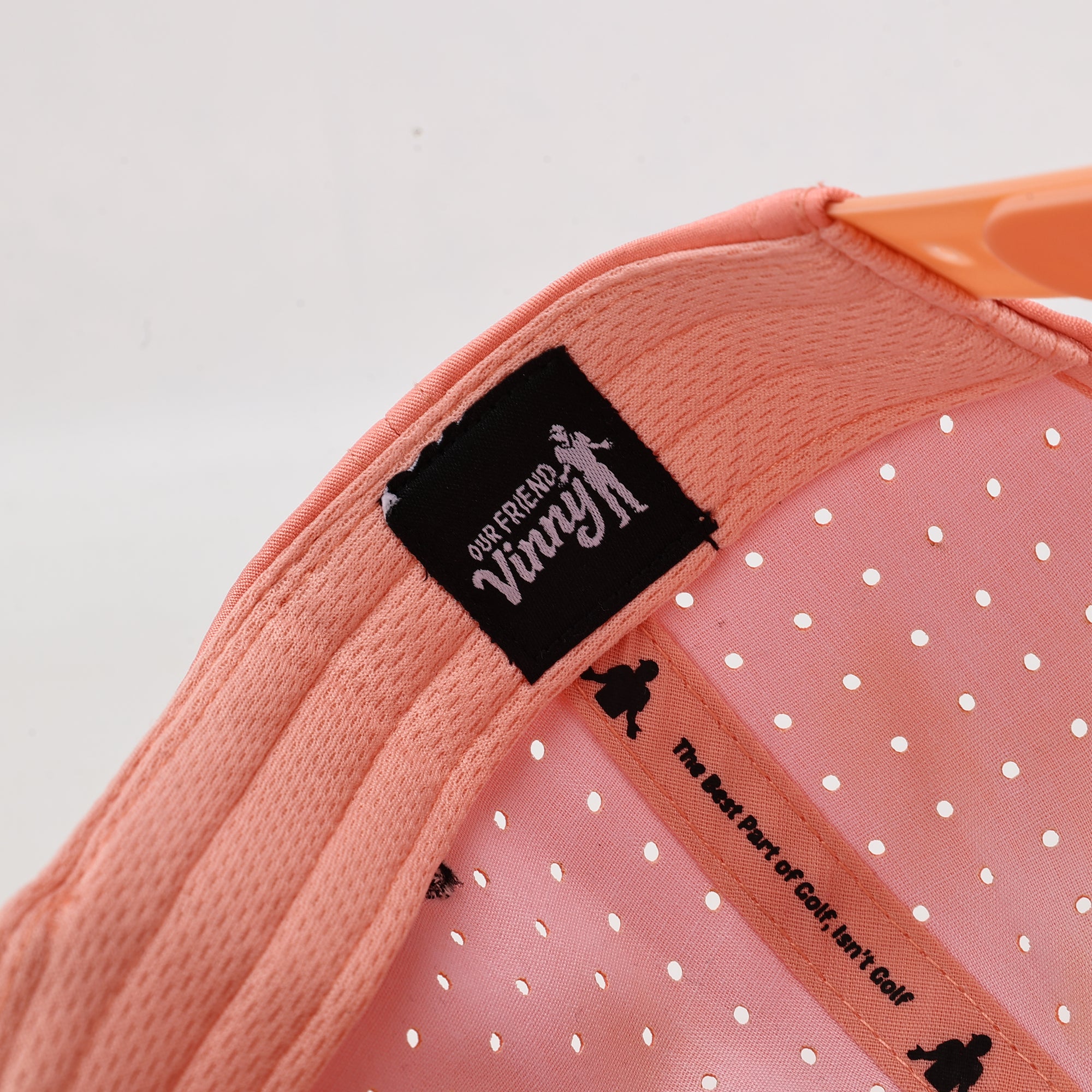 Pink baseball cap with perforated design 