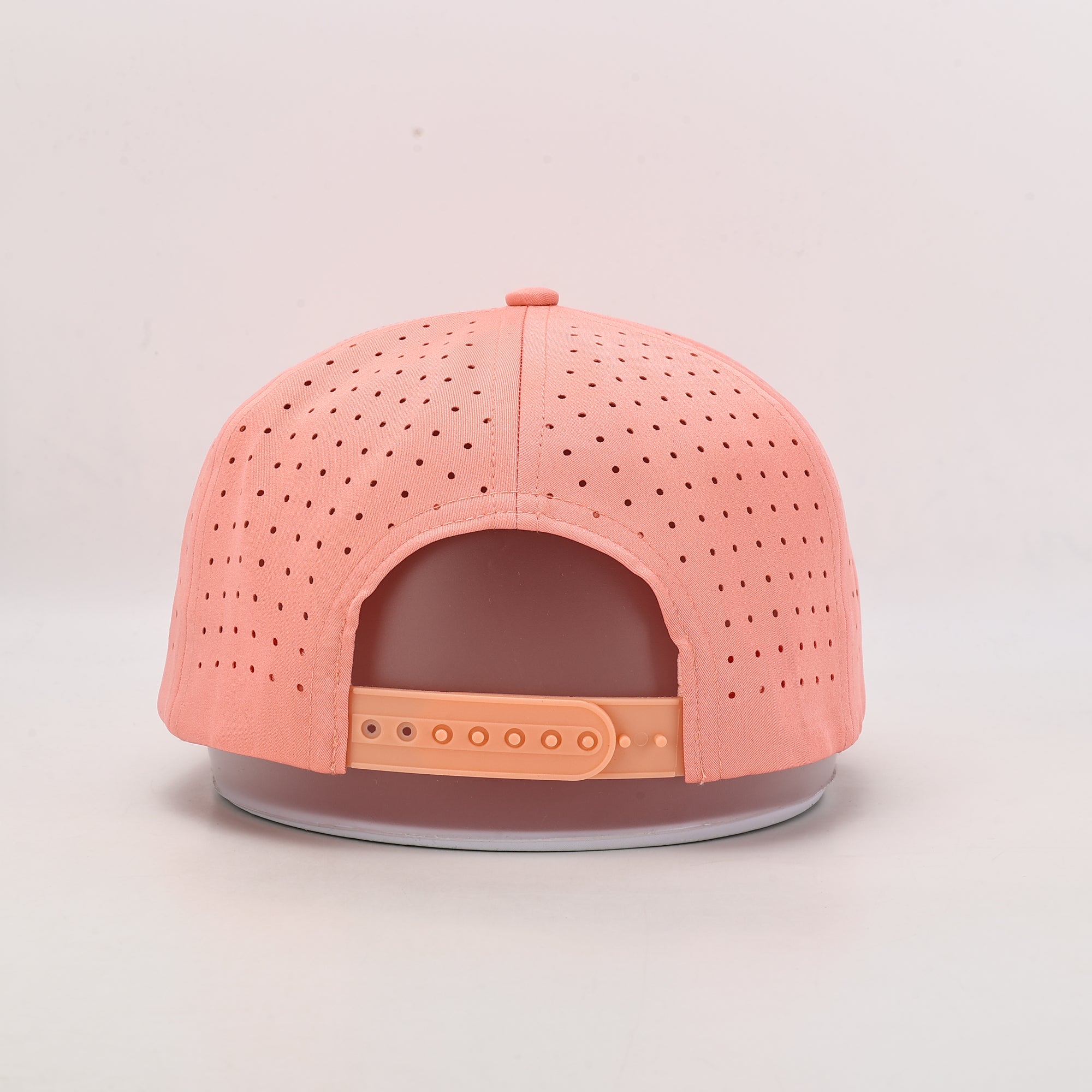 Pink baseball cap with perforated design rear 