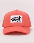 Coral cap with 'Our Friend Vinny' patch on a light gray background