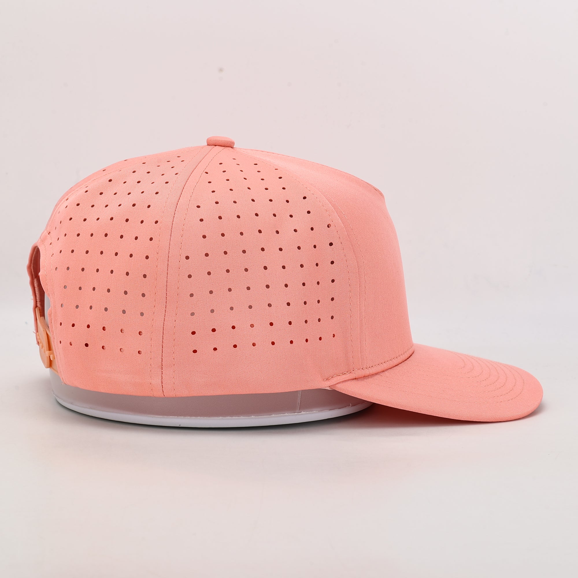Pink baseball cap with perforated design 