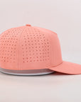 Pink baseball cap with perforated design 