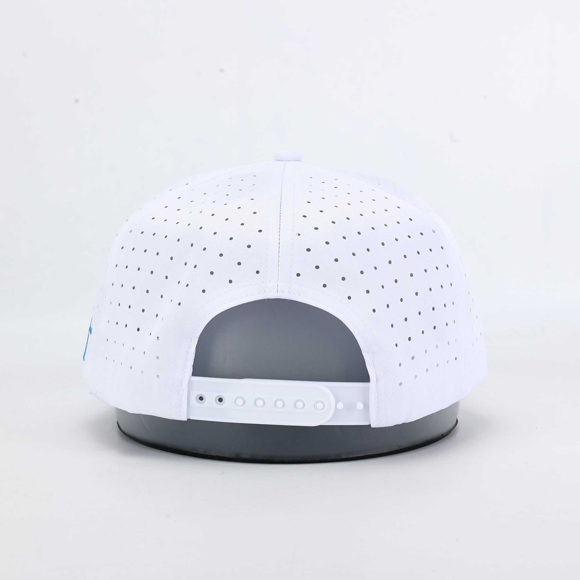 White cap with gray brim on a light gray background