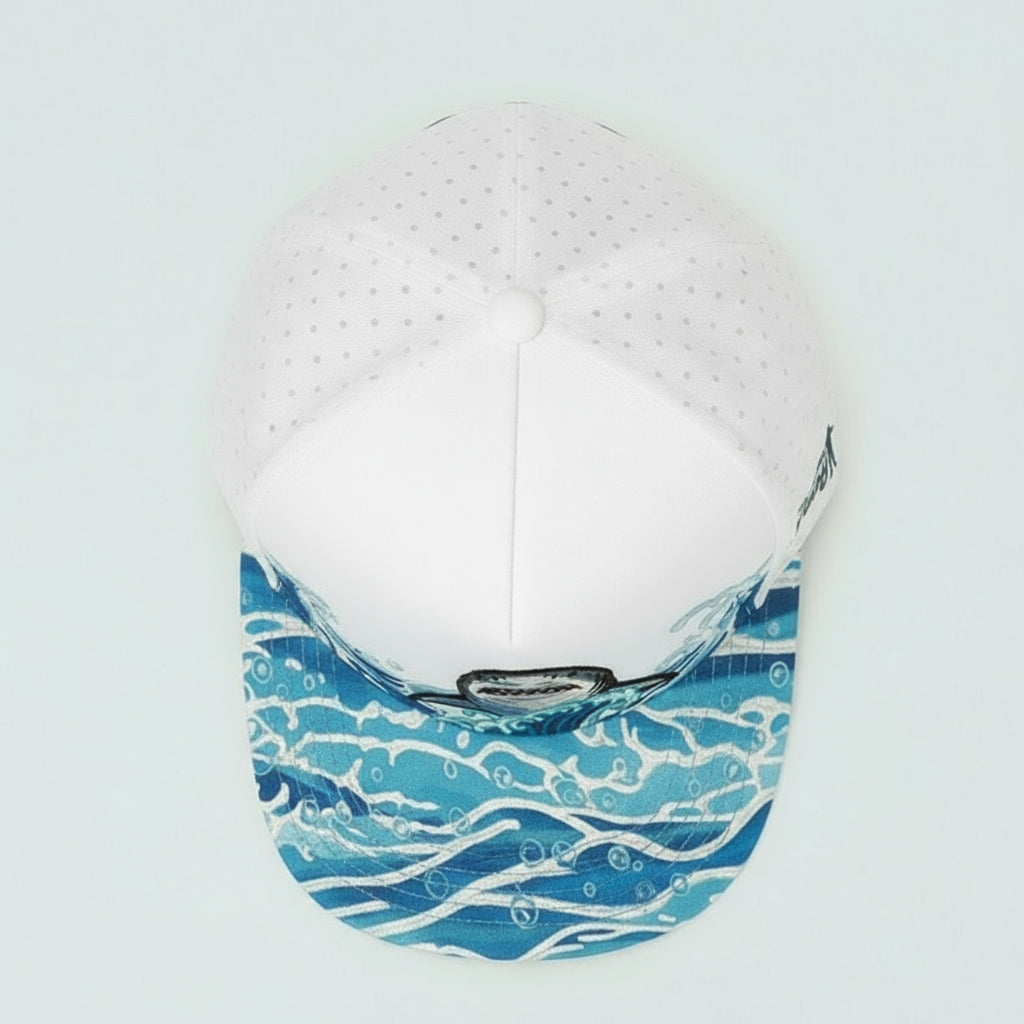 White cap with blue wave pattern on a white background