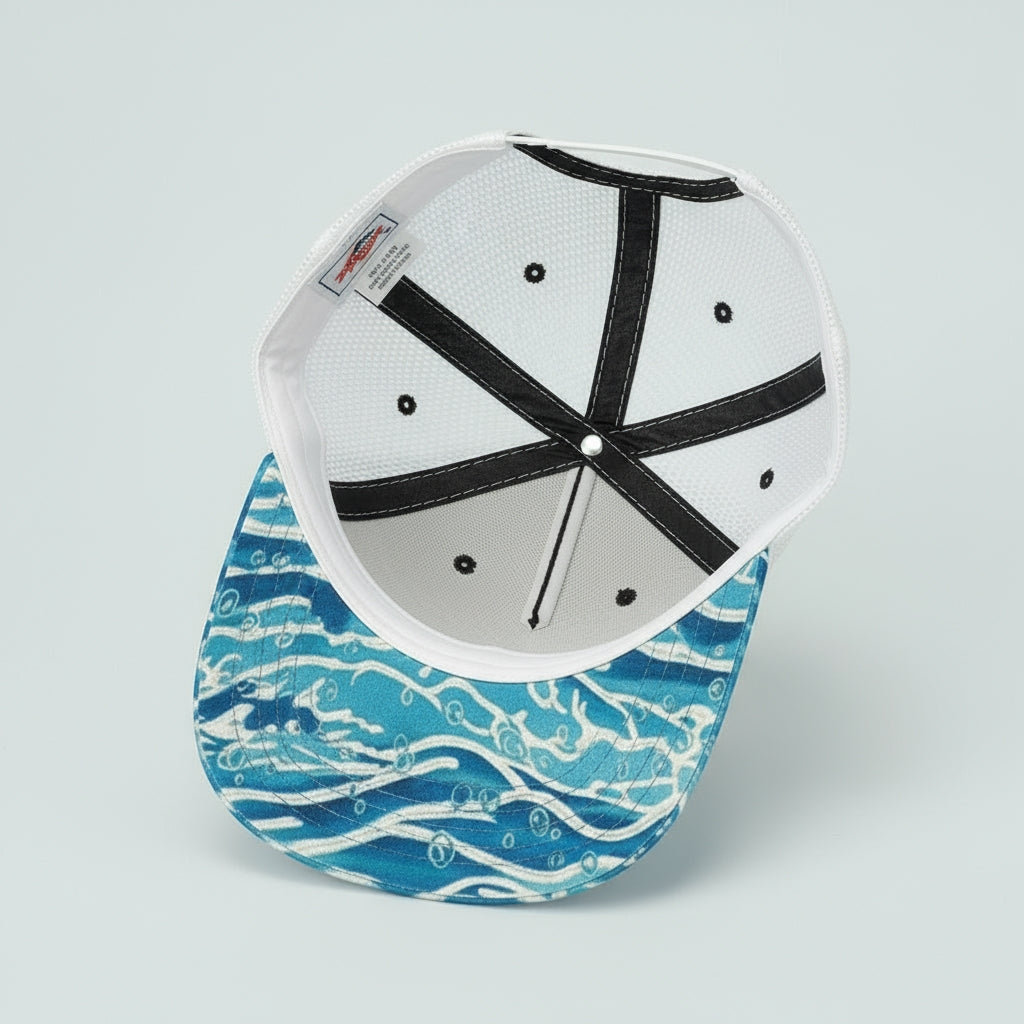 Cap with blue wave pattern on a white background