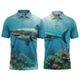 Two polo shirts with shark and underwater scenery designs on a white background