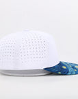 White cap with a blue and yellow pattern 