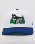 White cap with blue brim featuring a wolf and trees design on a white background