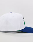 White and blue cap with a logo on a light gray background