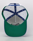 Green cap with a white interior and blue accents on a light gray background