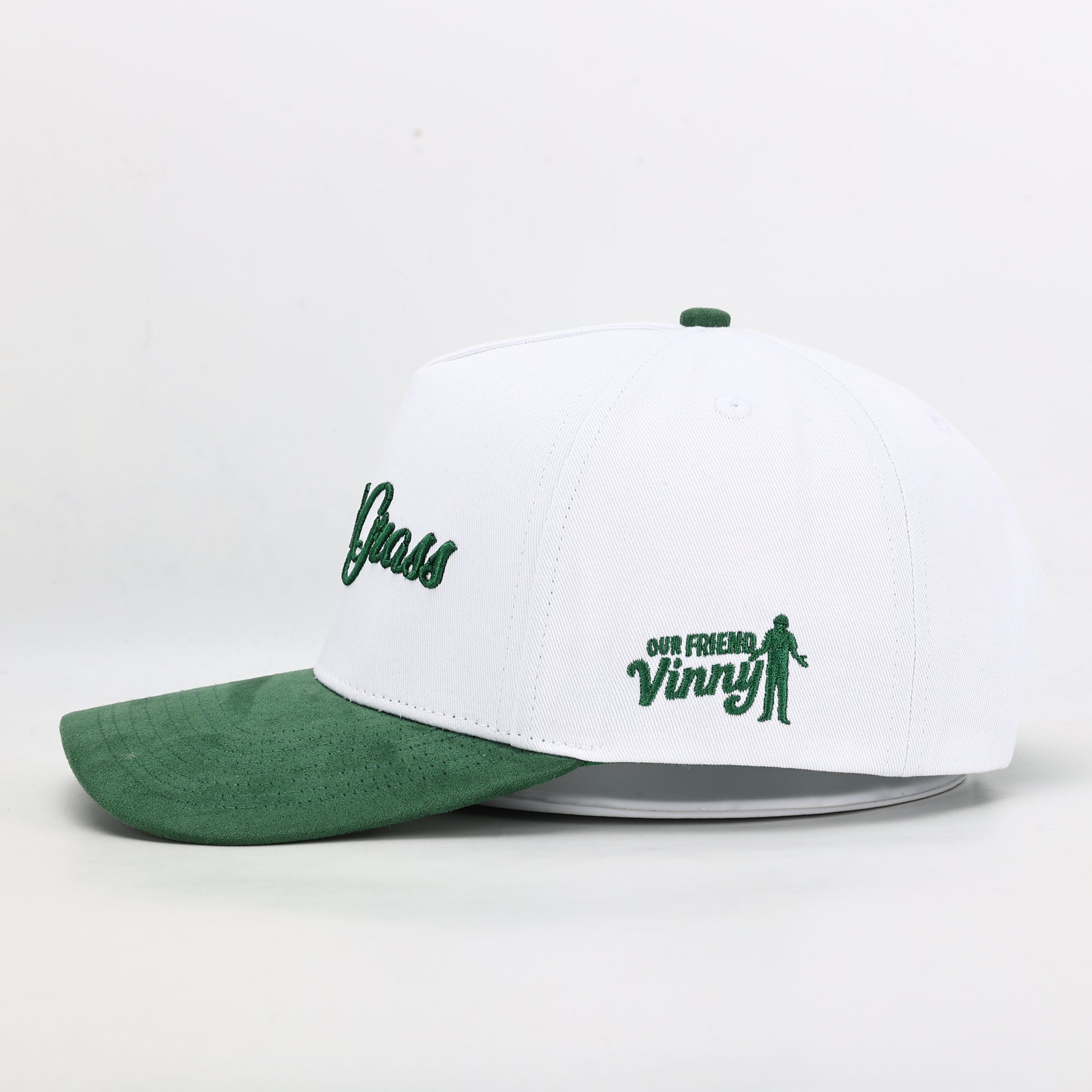 White and green cap with text and logo on a white background