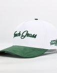 White and green cap with text on a white background