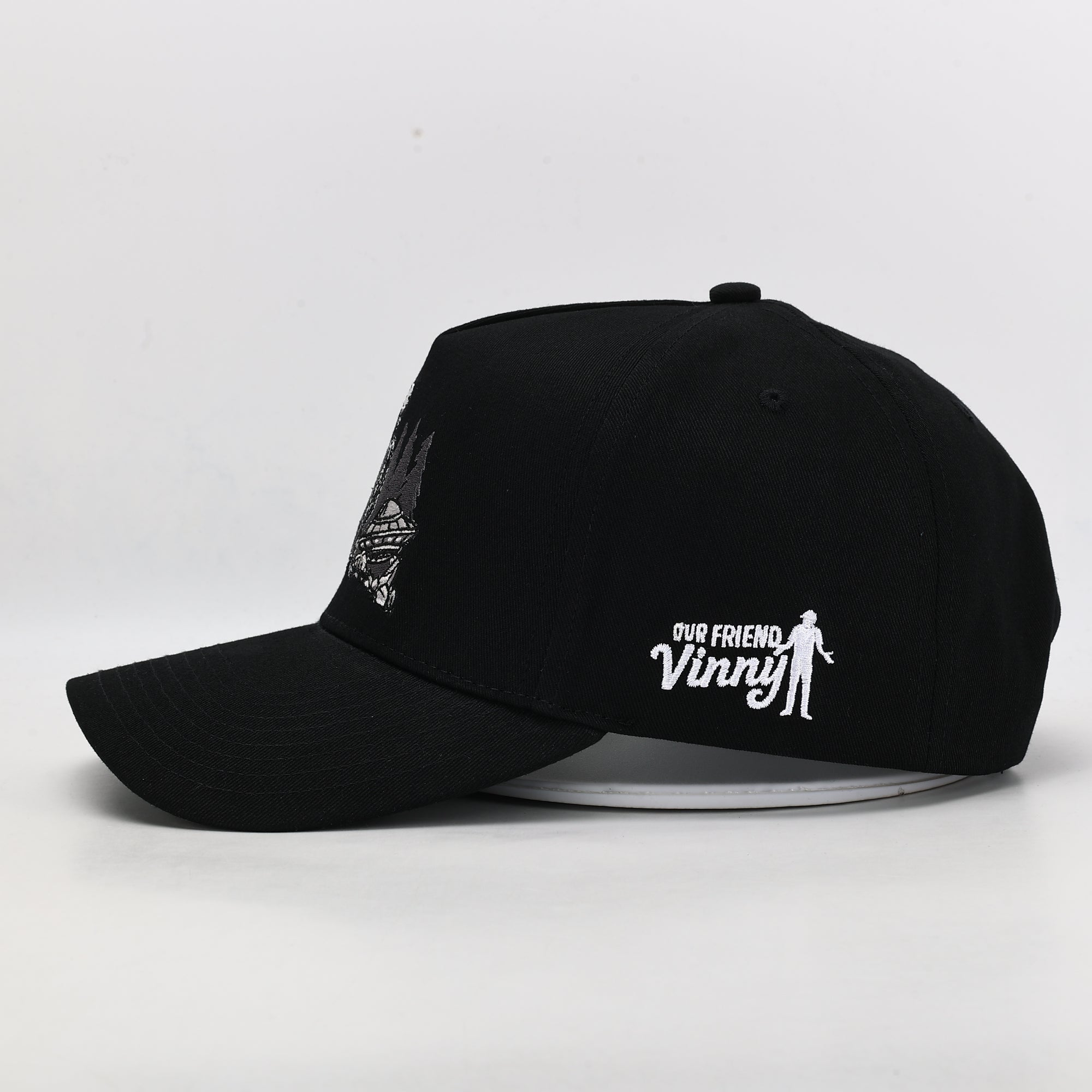 Black cap with 'Our Friend Vinny' logo on a white background