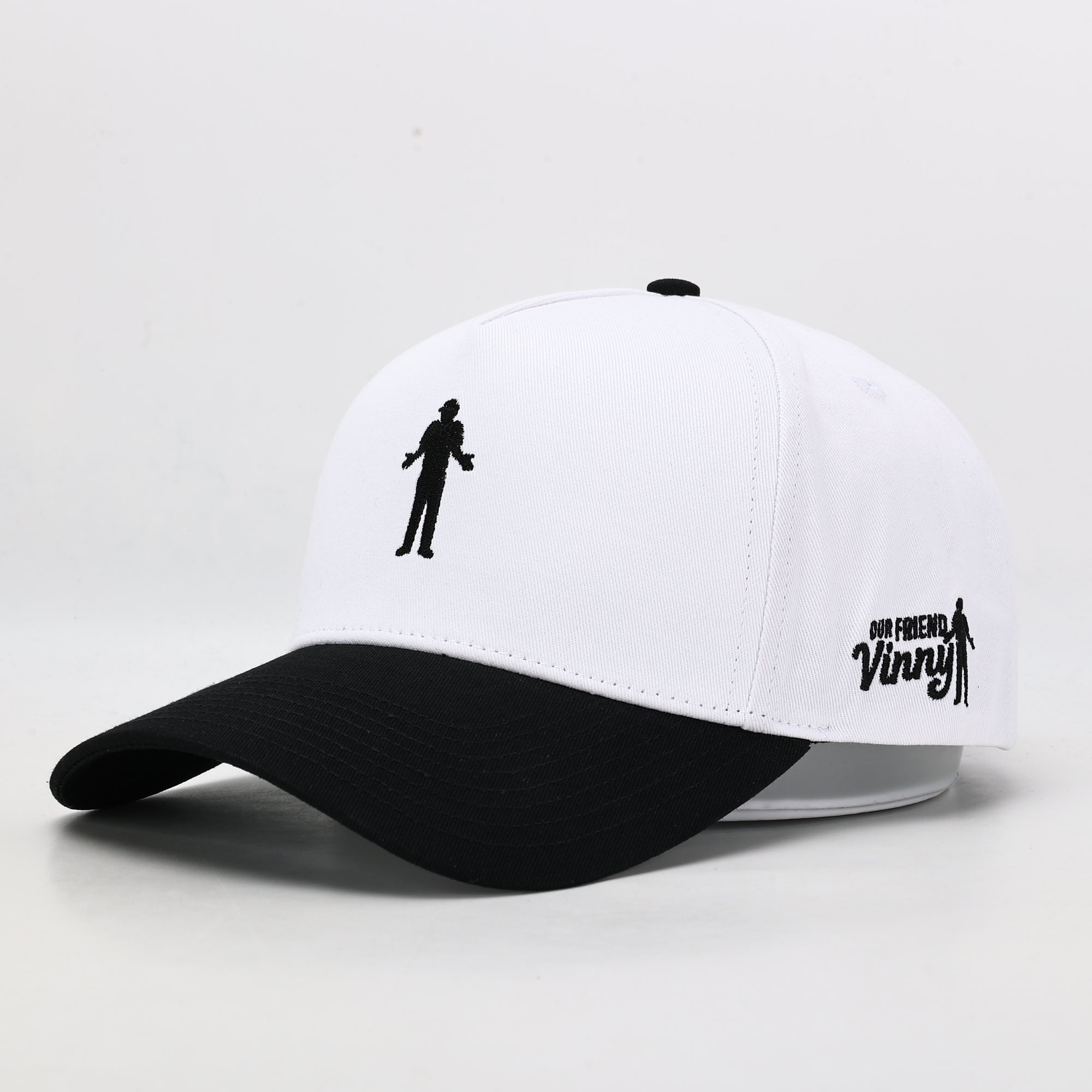 White golf cap with black brim 