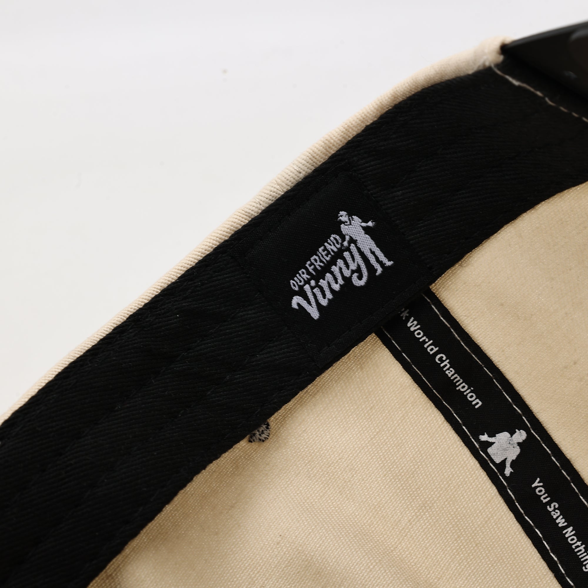 Close-up of a product with 'Our Friend Vinny' branding on a white background