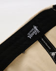 Close-up of a product with 'Our Friend Vinny' branding on a white background